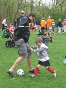 young boy playing soccer