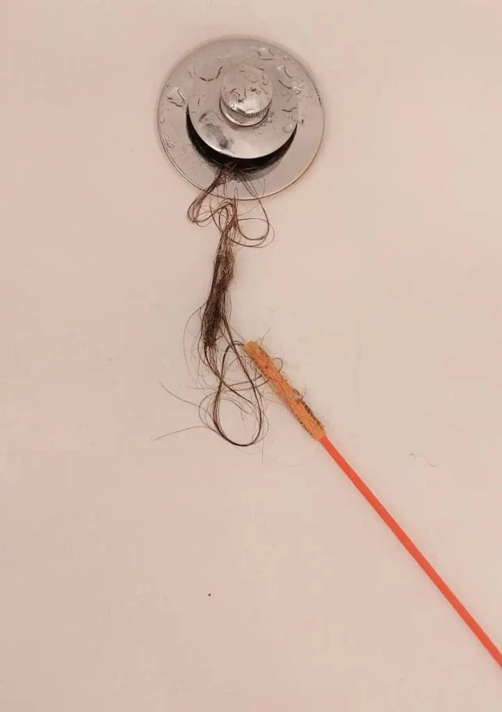 get hair out of drain