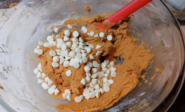 pumpkin cookie batter with white chocolate chips
